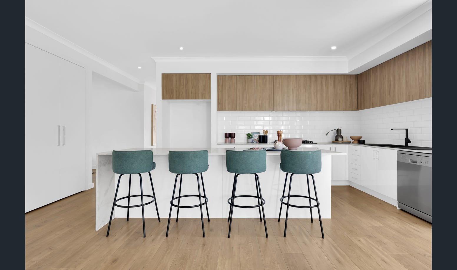 Two-tone kitchen with timber accents
